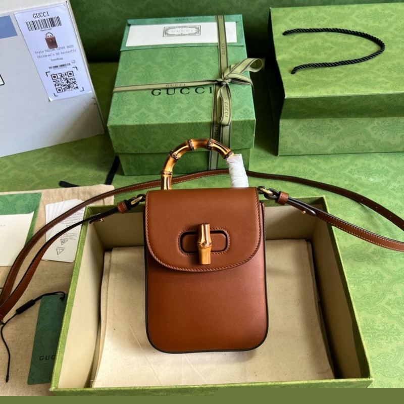 G*u*i top handle bags